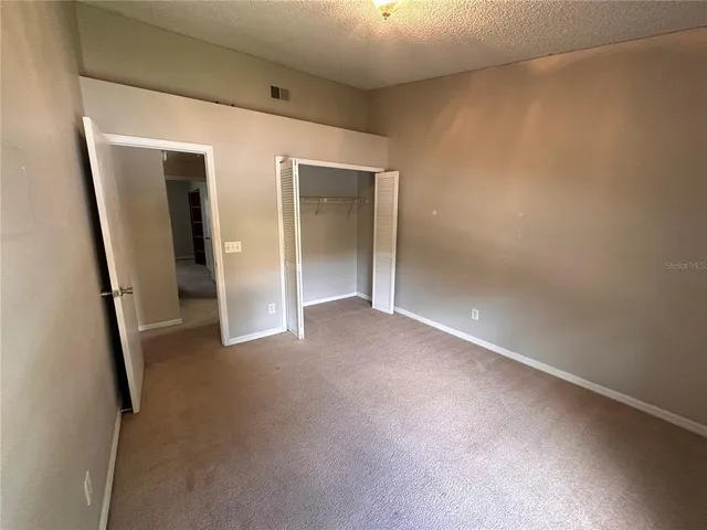 a view of a hallway with closet area
