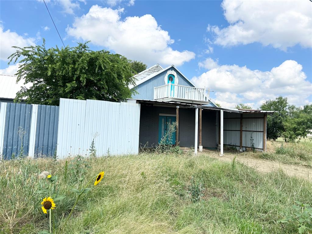 240 Weber Street Moran, TX 76464 - Photo 1 of 1 a front view of a house with garden