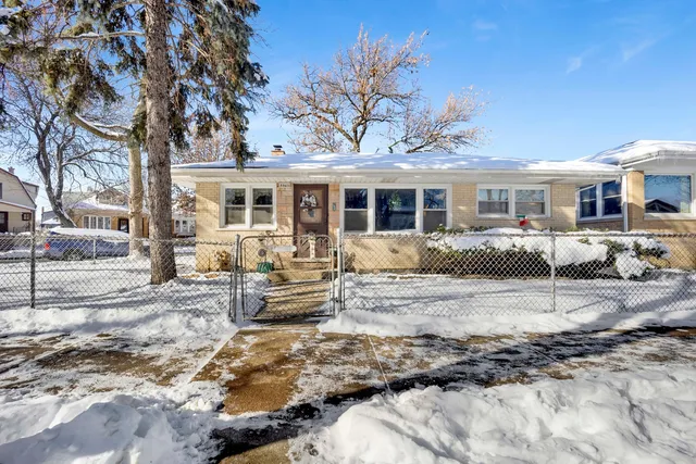 a view of a house with snow on the background