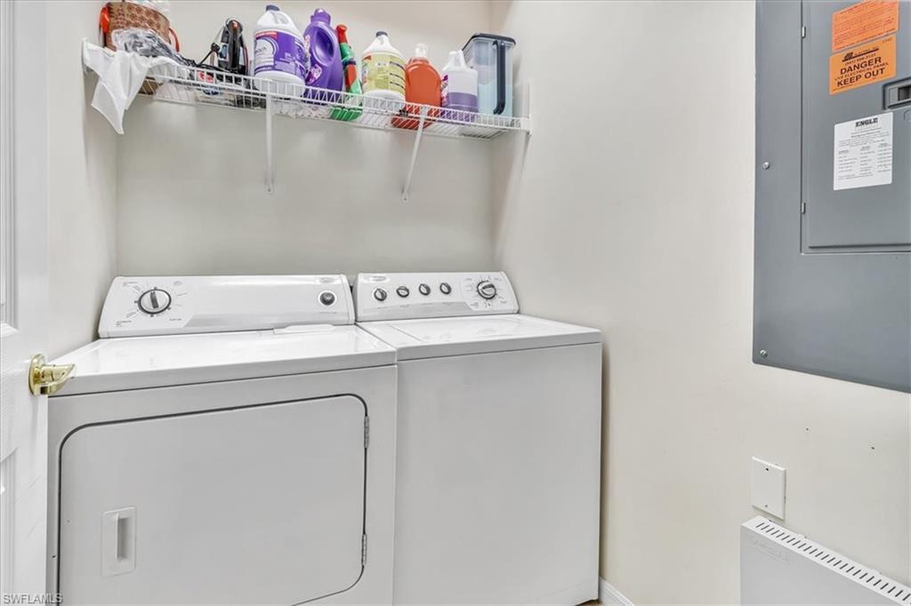 14130 Winchester Court, Unit 1503 Naples, FL 34114 - Photo 17 of 39 Washroom with washer and dryer and radiator