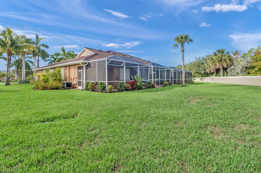 14130 Winchester Court, Unit 1503 Naples, FL 34114 - Photo 26 of 39 View of yard featuring glass enclosure