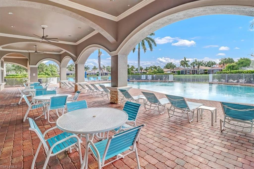 14130 Winchester Court, Unit 1503 Naples, FL 34114 - Photo 35 of 39 View of terrace featuring a community pool and ceiling fan