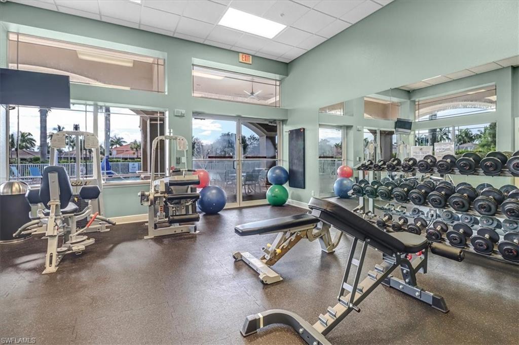 14130 Winchester Court, Unit 1503 Naples, FL 34114 - Photo 38 of 39 Exercise room featuring a paneled ceiling