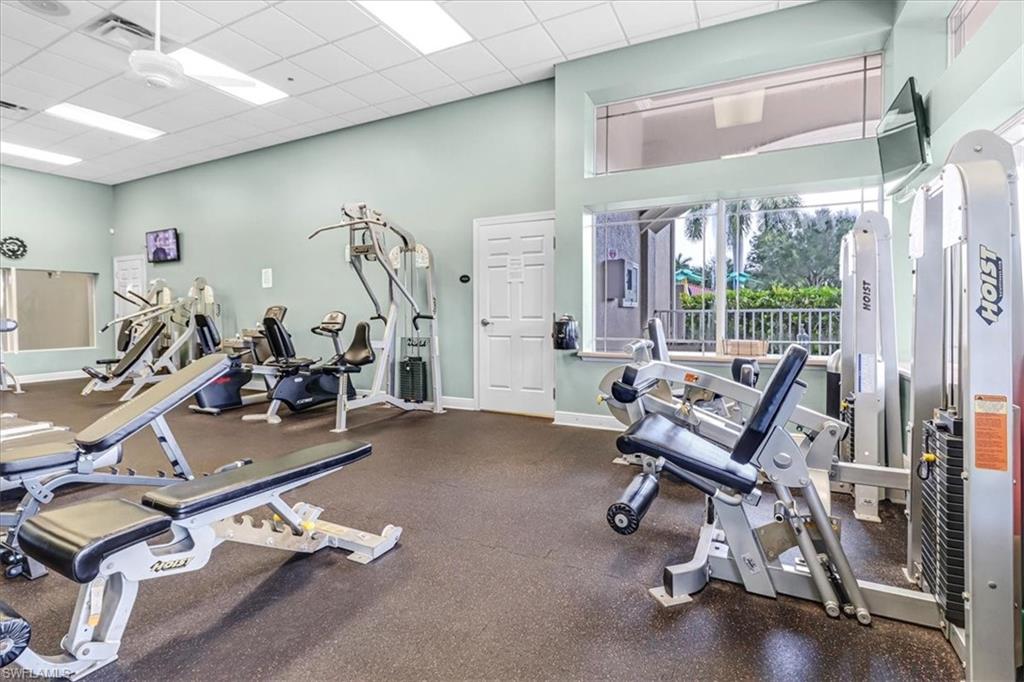 14130 Winchester Court, Unit 1503 Naples, FL 34114 - Photo 39 of 39 Workout area with a towering ceiling and a paneled ceiling