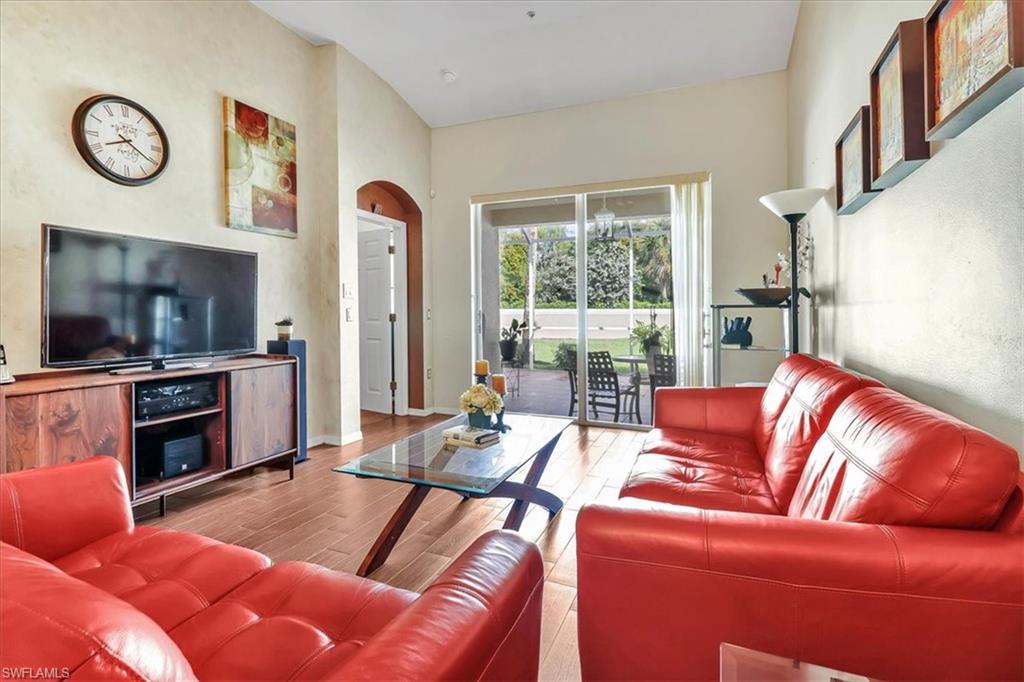 14130 Winchester Court, Unit 1503 Naples, FL 34114 - Photo 7 of 39 Living room featuring hardwood / wood-style floors