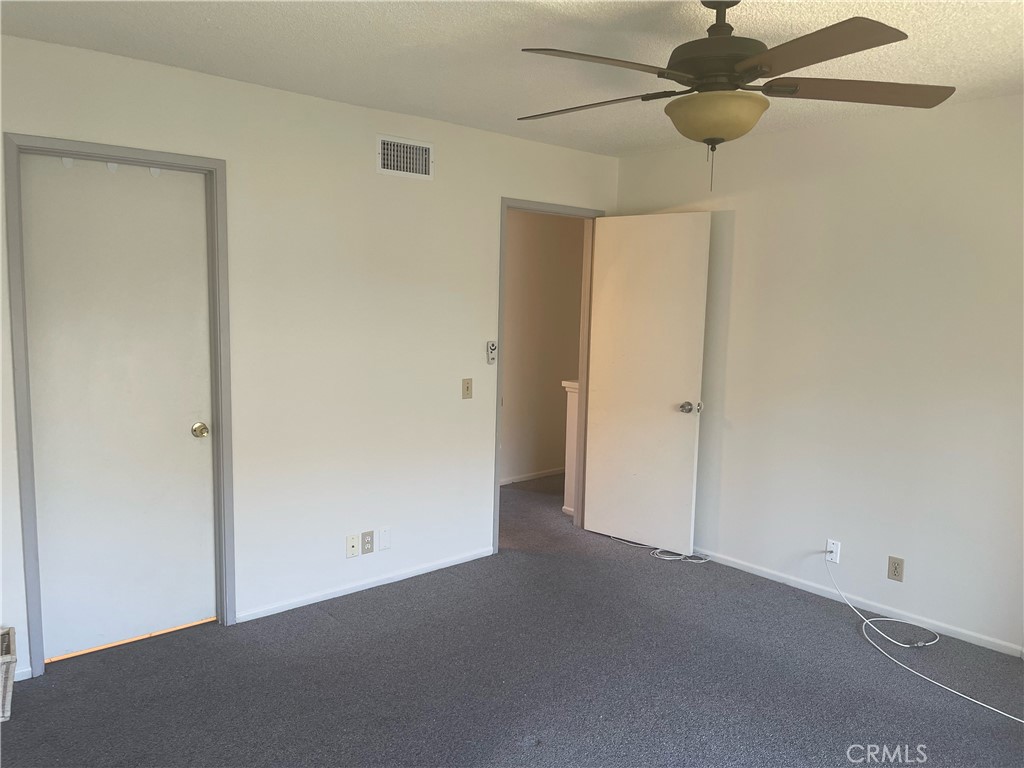 44 Briarwood Irvine, CA 92604 - Photo 13 of 16 an empty room with a ceiling fan and a window