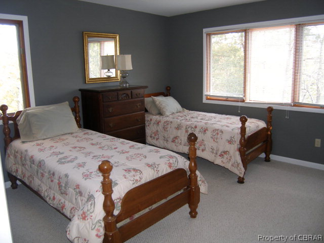 879 West Point Road Lancaster, VA 22503 - Photo 18 of 38 a bedroom with two beds and a window