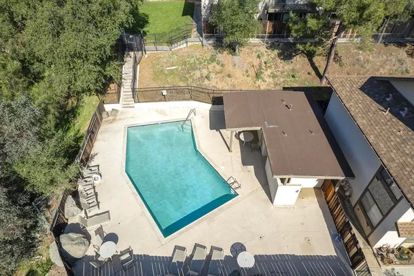 an aerial view of a house with a yard