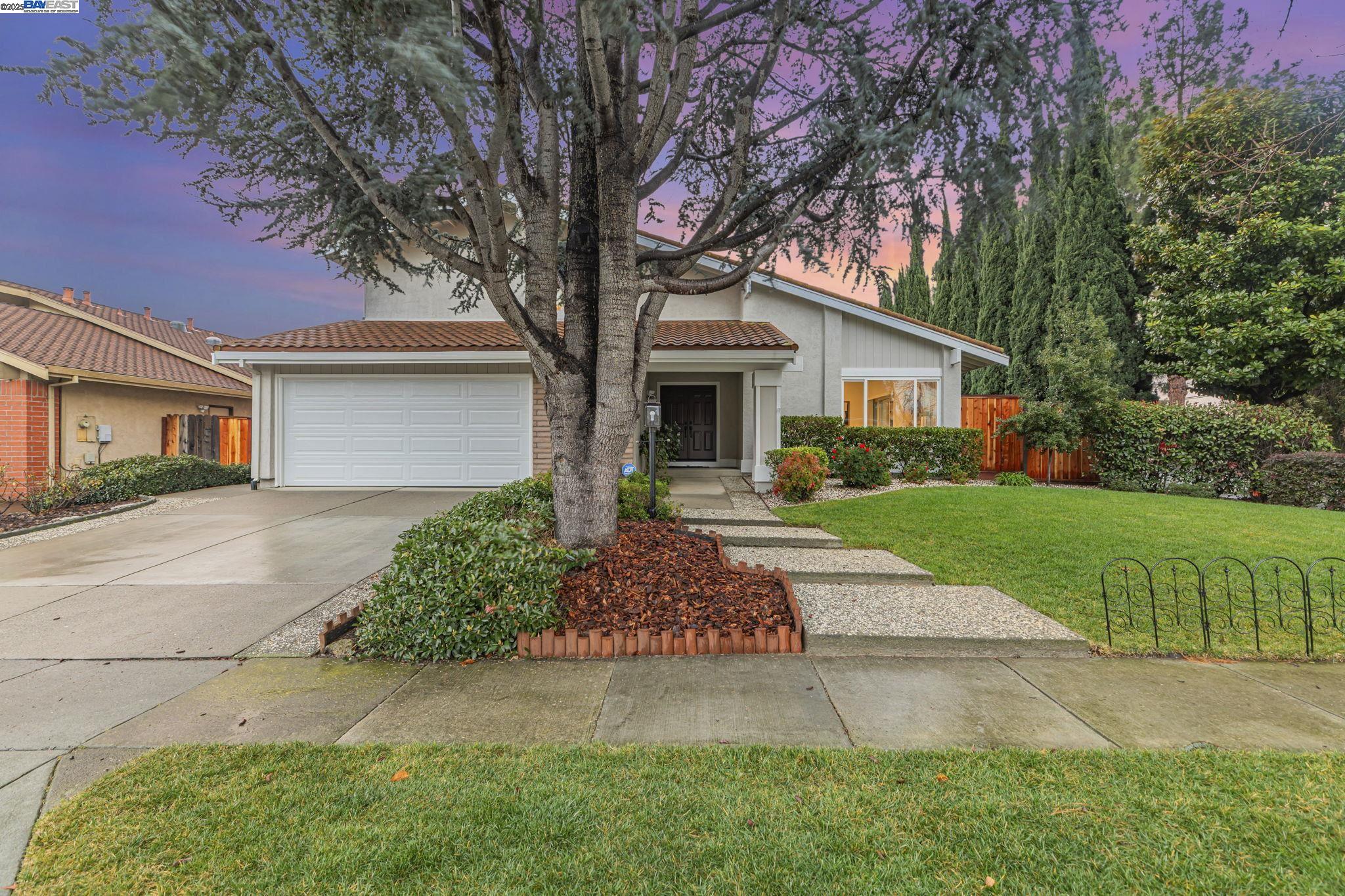 820 Optimo Avenue Fremont, CA 94539 - Photo 1 of 1 a front view of a house with garden