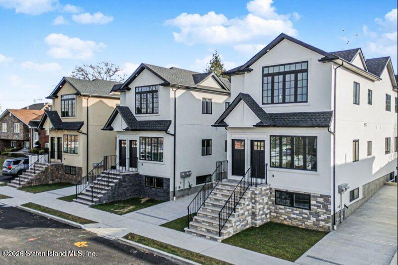 907 Rathbun Avenue Staten Island, NY 10309 - Photo 2 of 36 front view of a house with a yard