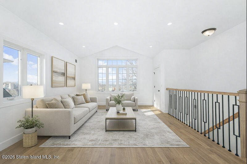 907 Rathbun Avenue Staten Island, NY 10309 - Photo 21 of 36 a living room with furniture and a large window