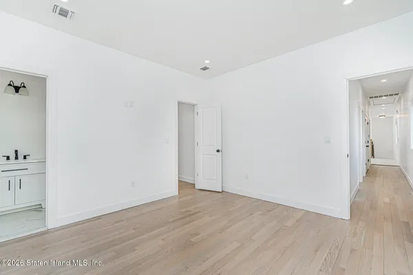an empty room with wooden floor