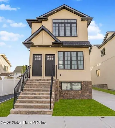 a front view of a house with a yard