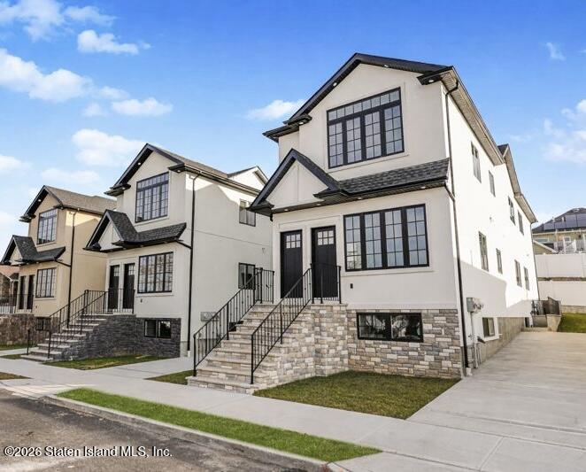 907 Rathbun Avenue Staten Island, NY 10309 - Photo 4 of 36 a front view of a house with a yard