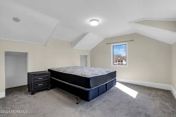 a room with a bed and a desk