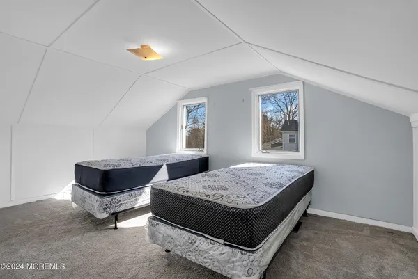 a living room with couch and window