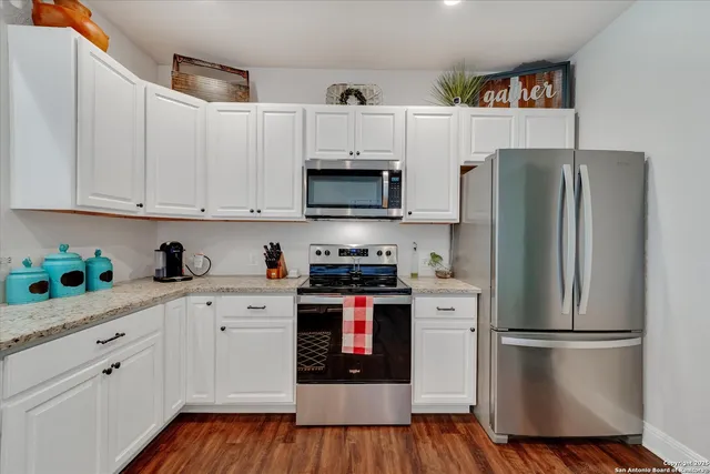 a bathroom with a sink a vanity and a mirror