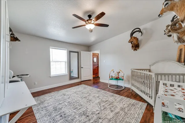 a bedroom with furniture and a window