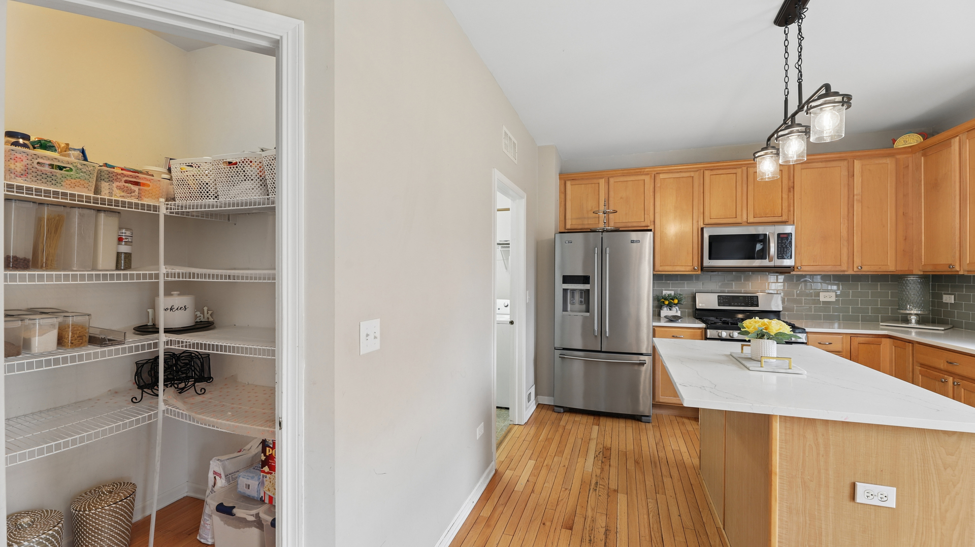 210 Honeysuckle Street Bolingbrook, IL 60490 - Photo 13 of 37 a kitchen with wooden cabinets and a refrigerator