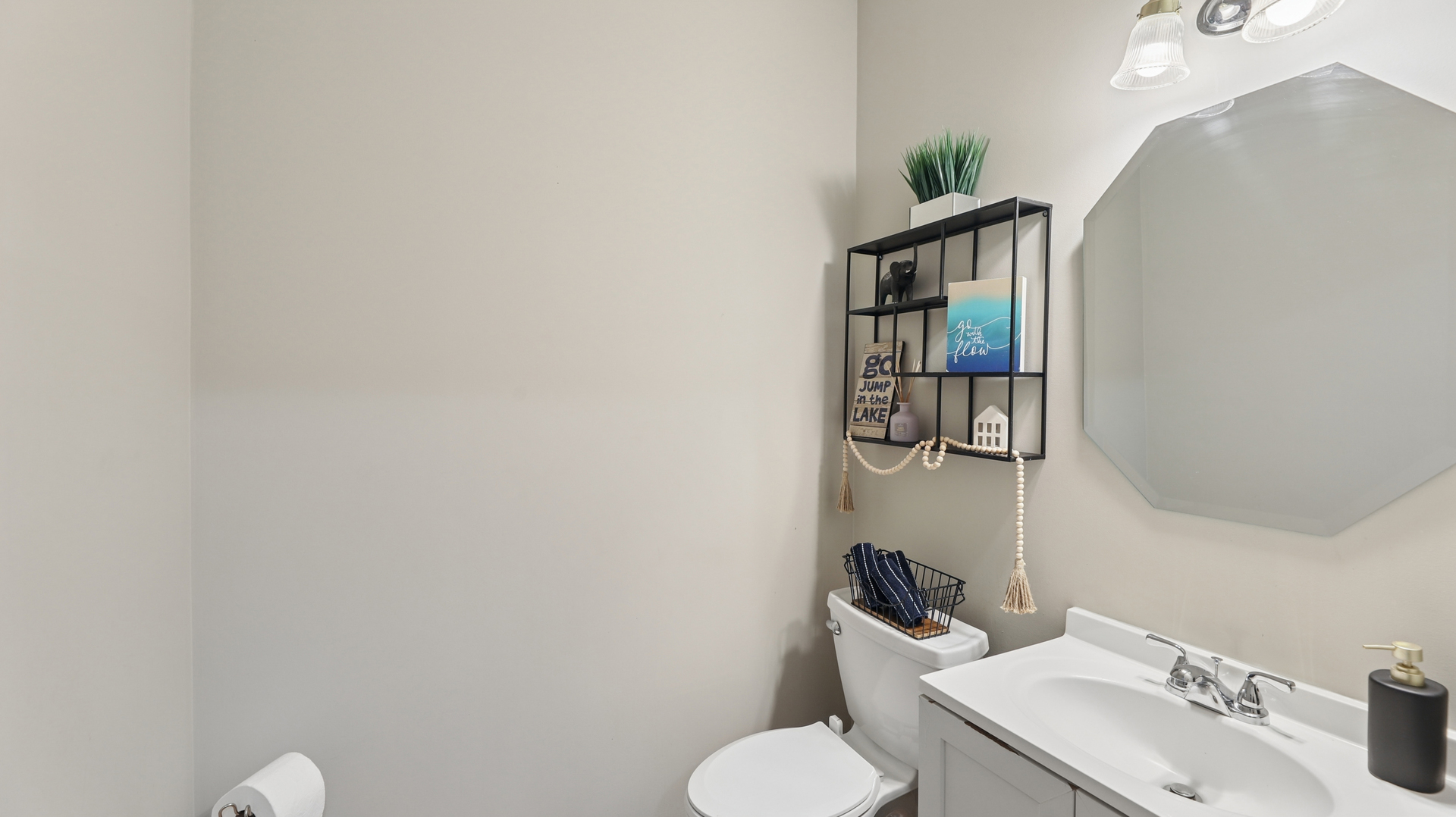210 Honeysuckle Street Bolingbrook, IL 60490 - Photo 14 of 37 a bathroom with a sink toilet and mirror