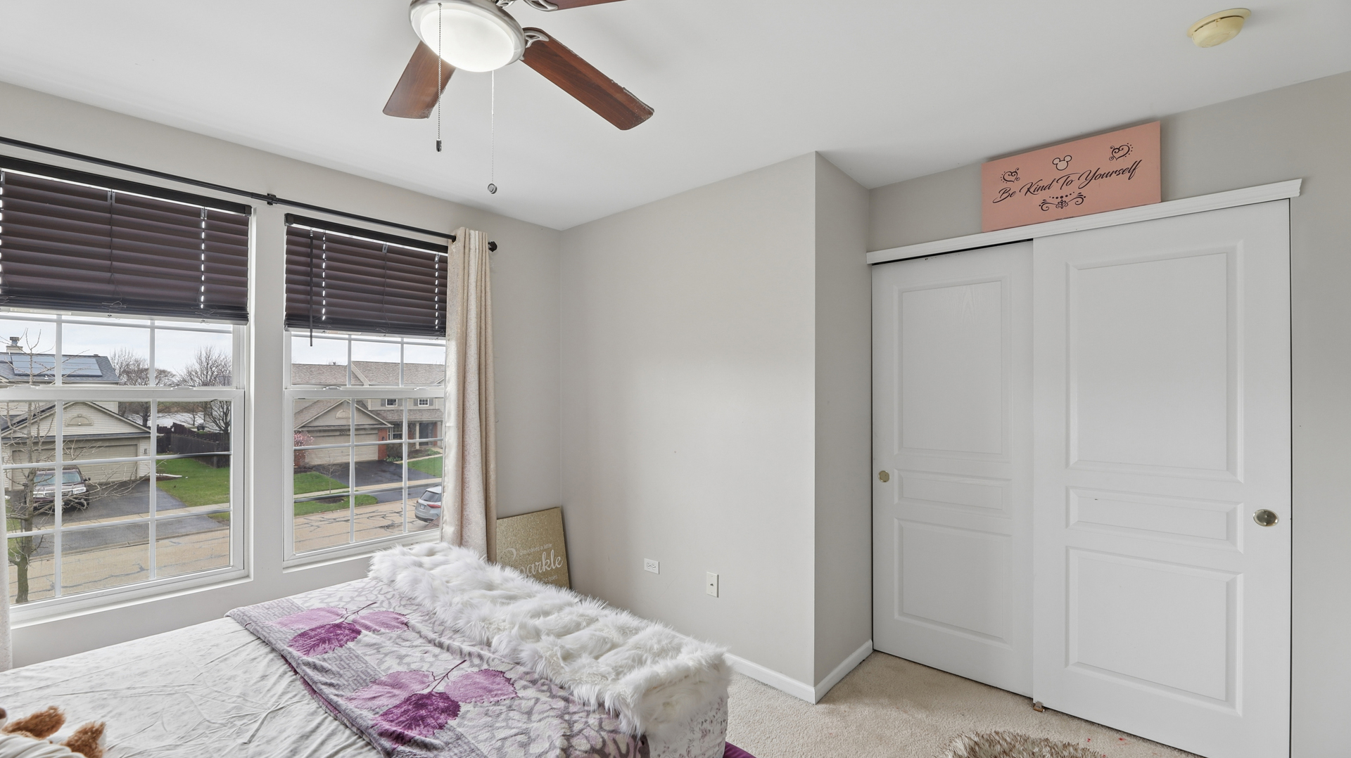 210 Honeysuckle Street Bolingbrook, IL 60490 - Photo 16 of 37 a bedroom with a bed and a chandelier