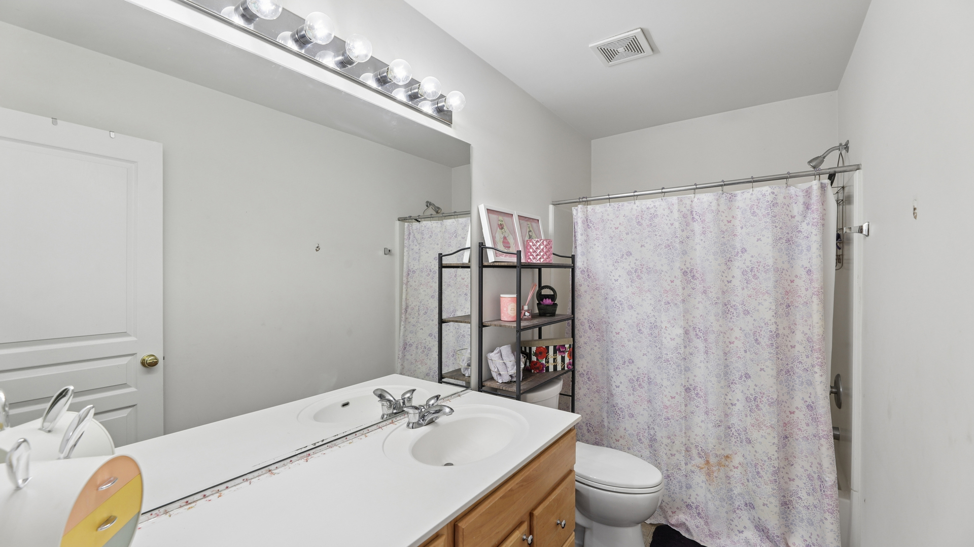 210 Honeysuckle Street Bolingbrook, IL 60490 - Photo 23 of 37 a bathroom with a sink toilet and shower
