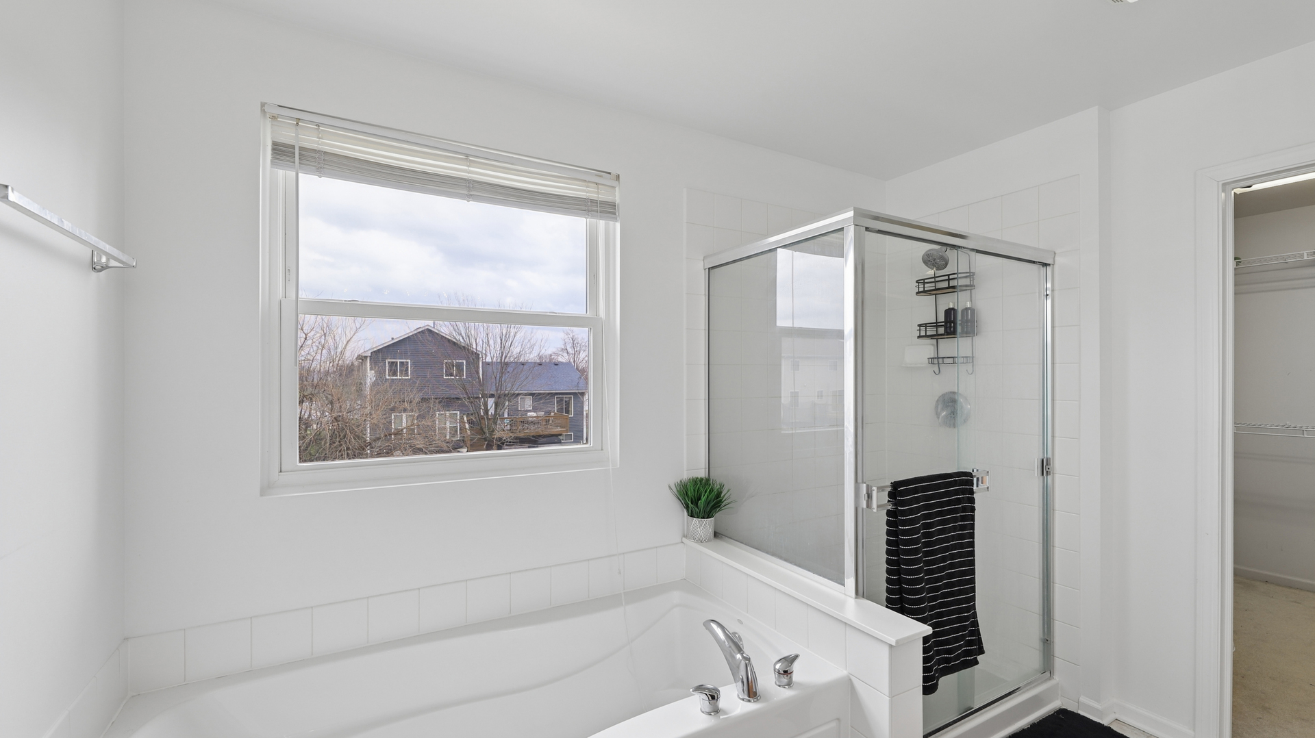 210 Honeysuckle Street Bolingbrook, IL 60490 - Photo 28 of 37 a bathroom with a bathtub and a shower