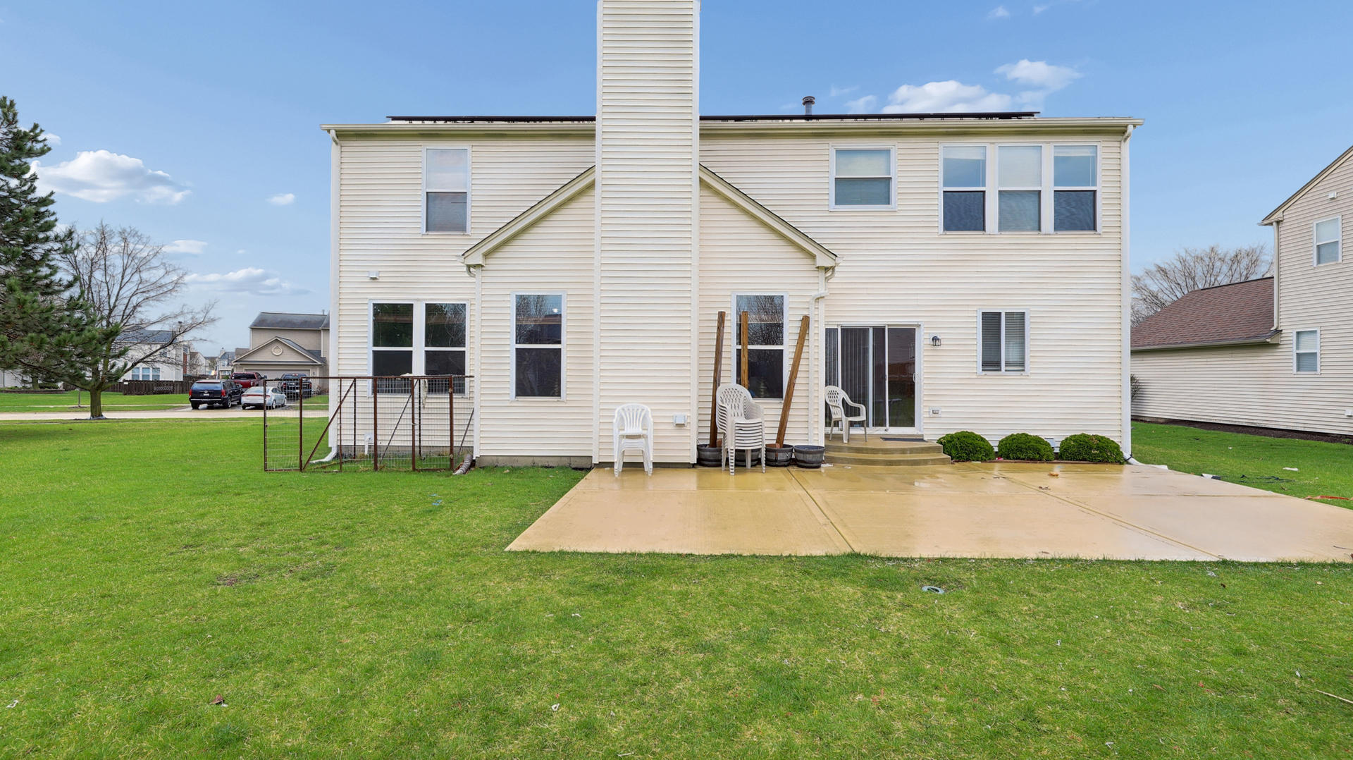 210 Honeysuckle Street Bolingbrook, IL 60490 - Photo 35 of 37 a view of a house with a patio and a yard