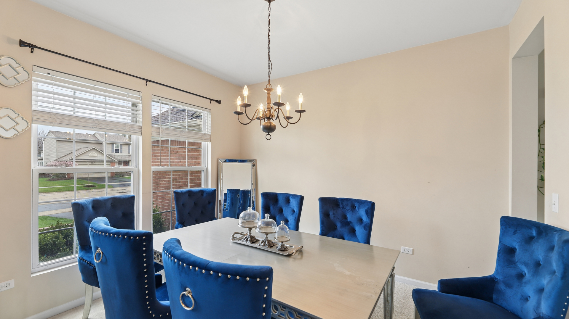 210 Honeysuckle Street Bolingbrook, IL 60490 - Photo 4 of 37 a dining room with furniture a window and a chandelier