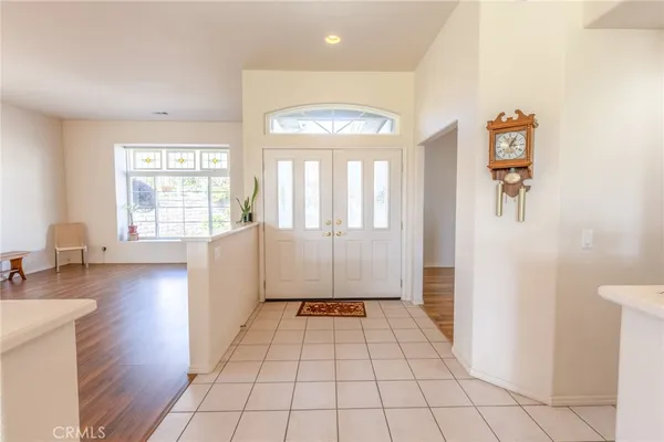 a view of an entryway with wooden floor