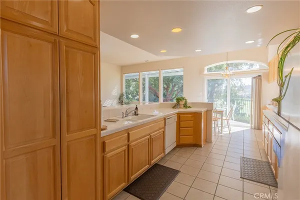 a large bathroom with a double vanity sink a mirror and a shower