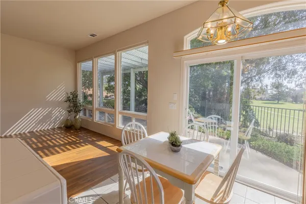 a view of a dining room with furniture window and outside view