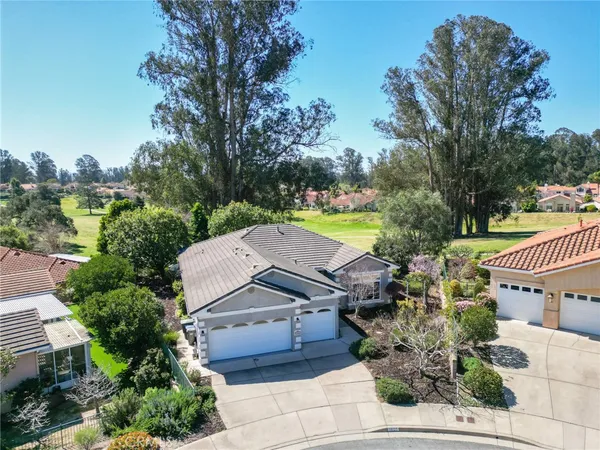 an aerial view of a house with a garden