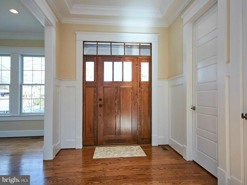 6000 27th Street North Arlington, VA 22207 - Photo 2 of 30 an empty room with wooden floor and windows