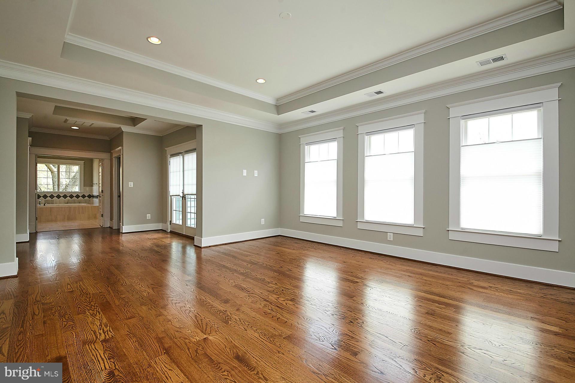 6000 27th Street North Arlington, VA 22207 - Photo 12 of 30 a view of an empty room with wooden floor and a window