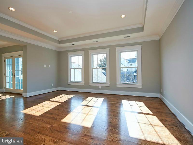 6000 27th Street North Arlington, VA 22207 - Photo 13 of 30 a view of empty room with wooden floor and fan