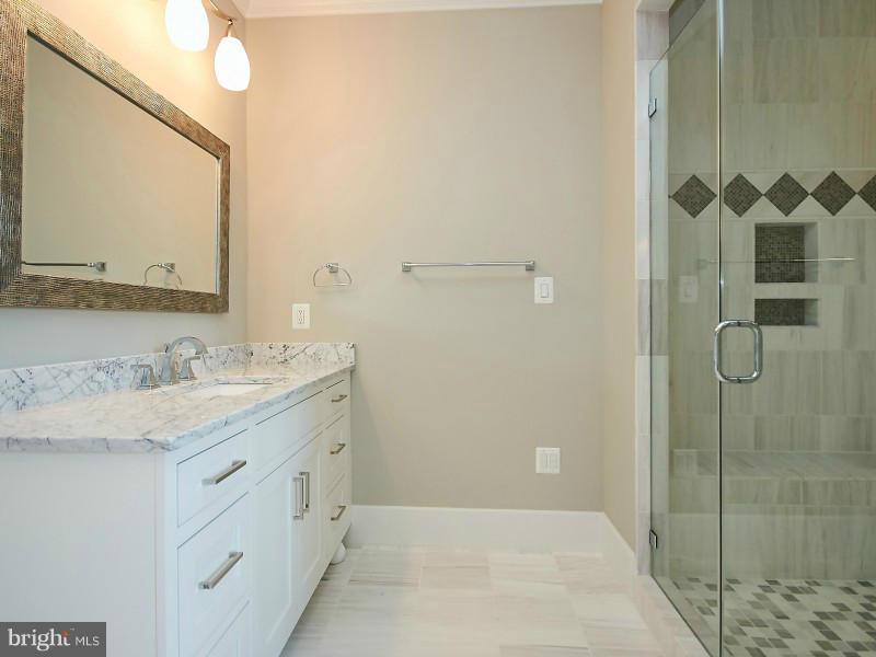 6000 27th Street North Arlington, VA 22207 - Photo 15 of 30 a bathroom with a granite countertop sink mirror and double