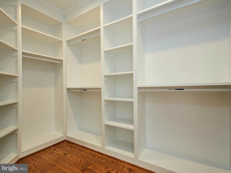 6000 27th Street North Arlington, VA 22207 - Photo 18 of 30 a view of walk in closet with empty racks
