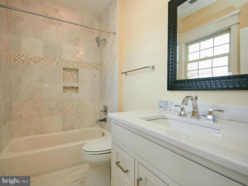6000 27th Street North Arlington, VA 22207 - Photo 20 of 30 a bathroom with a sink a toilet and a bathtub