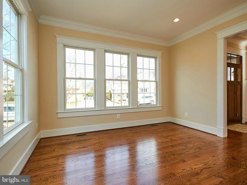 6000 27th Street North Arlington, VA 22207 - Photo 3 of 30 a view of an empty room with wooden floor and a window