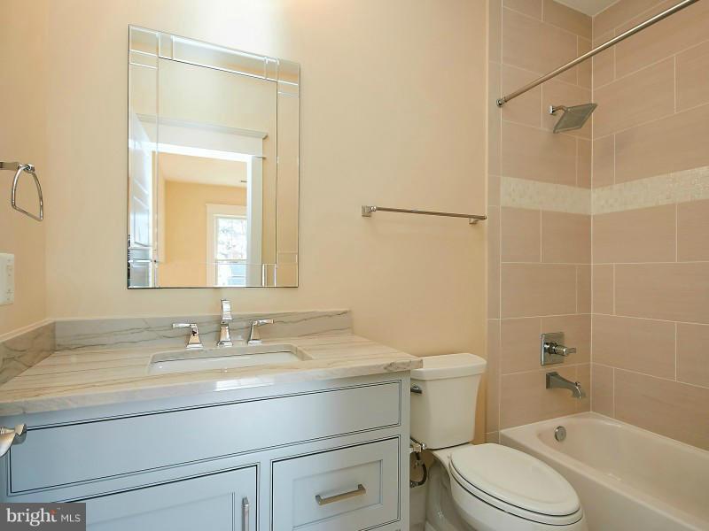6000 27th Street North Arlington, VA 22207 - Photo 25 of 30 a bathroom with a sink toilet vanity and shower