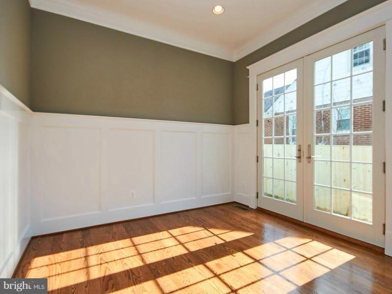 6000 27th Street North Arlington, VA 22207 - Photo 6 of 30 a view of empty room with wooden floor and fan