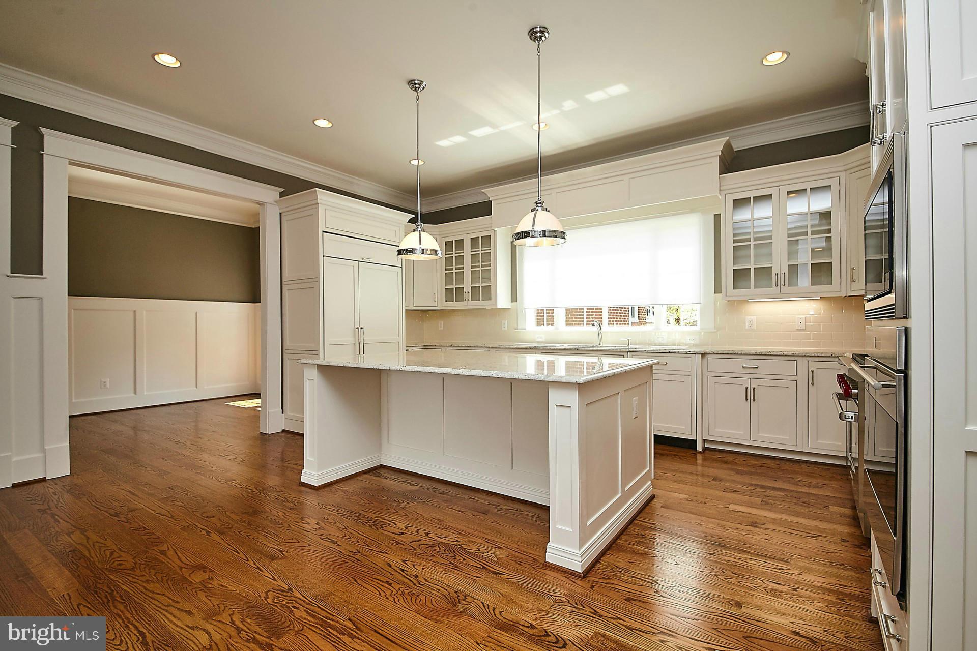 6000 27th Street North Arlington, VA 22207 - Photo 7 of 30 a kitchen with a sink window and stainless steel appliances