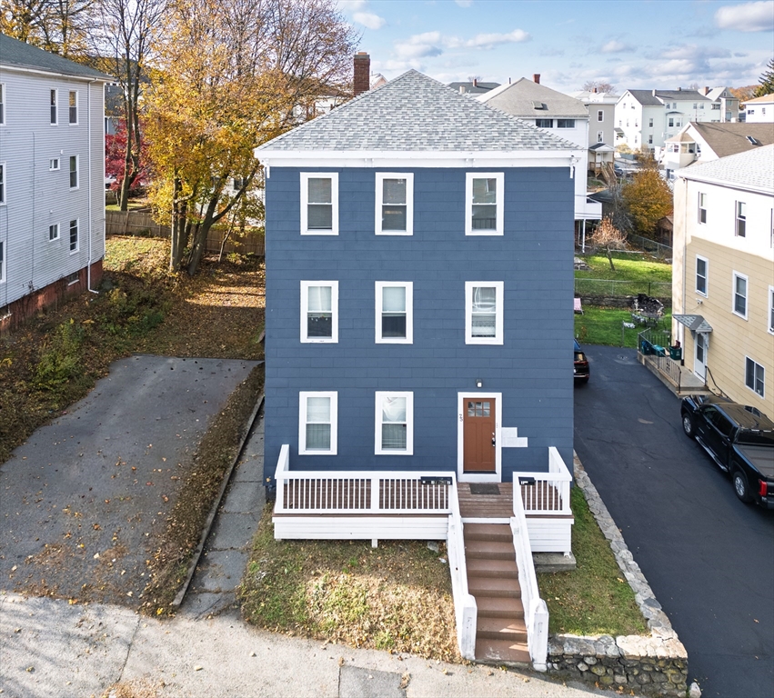 75 Gage Street, Unit 3 Worcester, MA 01605 - Photo 1 of 10 a front view of a house with a yard