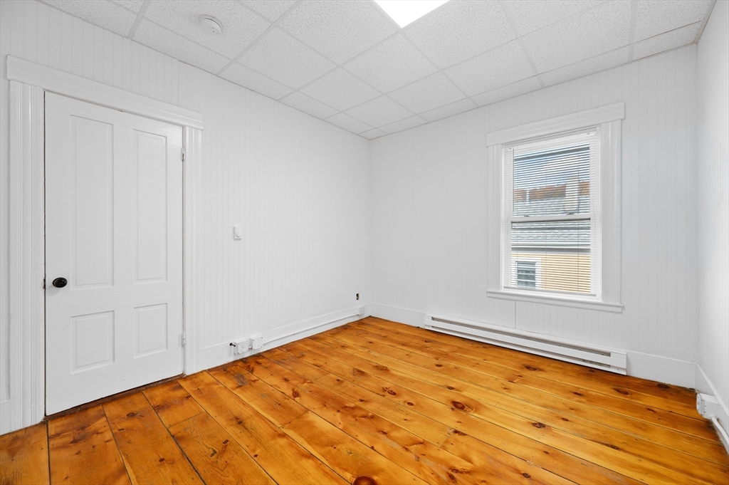 75 Gage Street, Unit 3 Worcester, MA 01605 - Photo 6 of 10 a view of empty room with wooden floor