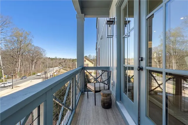 a view of balcony with furniture