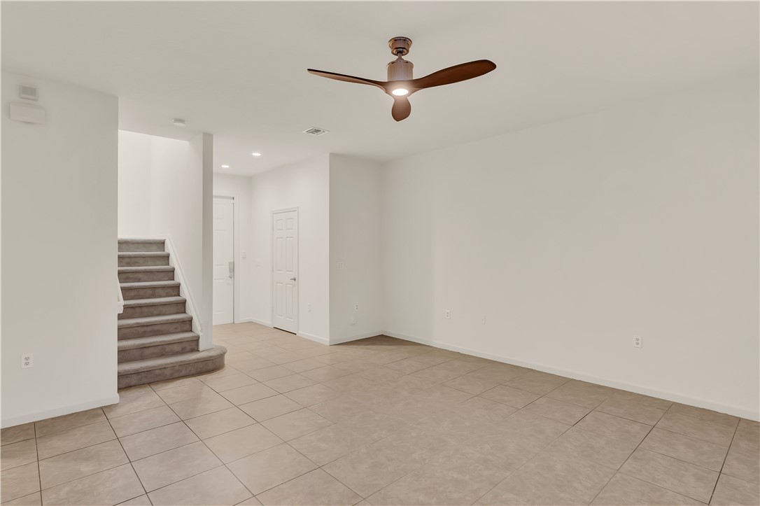 2541 Stockbridge Square Southwest Vero Beach, FL 32962 - Photo 11 of 33 a view of an empty room with a ceiling fan