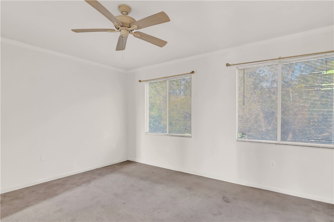 2541 Stockbridge Square Southwest Vero Beach, FL 32962 - Photo 18 of 33 an empty room with a window and a fan