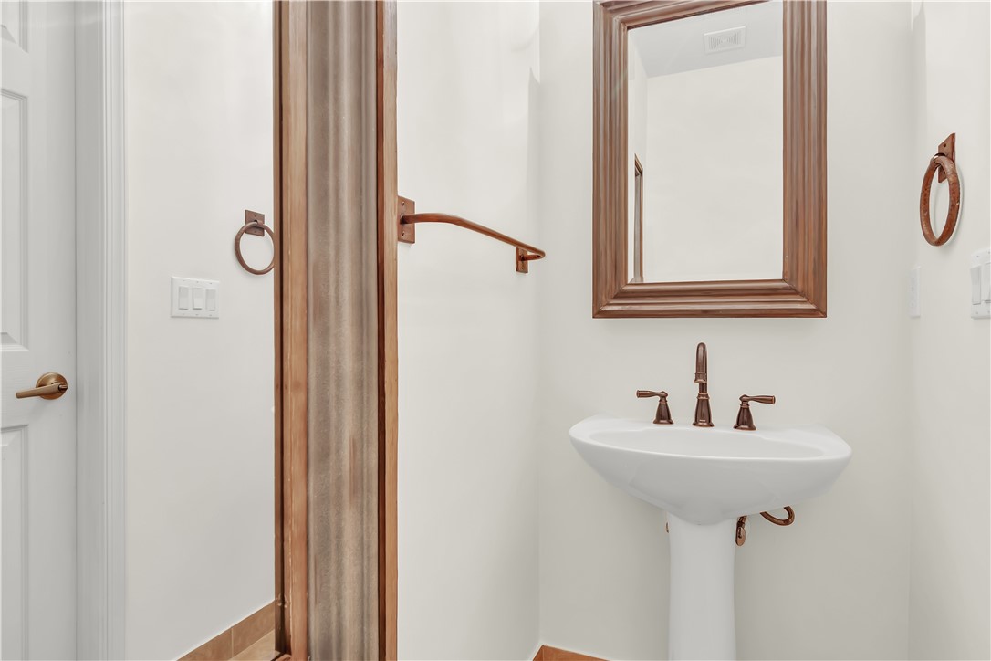 2541 Stockbridge Square Southwest Vero Beach, FL 32962 - Photo 21 of 33 a bathroom with a sink and mirror