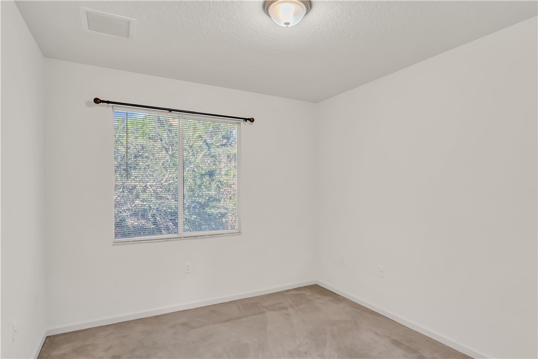 2541 Stockbridge Square Southwest Vero Beach, FL 32962 - Photo 25 of 33 an empty room with a window